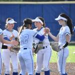 Liberty players meet up in the circle following an out. Ben Ray / The Reporter