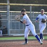 Abigail Handlin makes a throw to first base for Liberty. Ben Ray / The Reporter