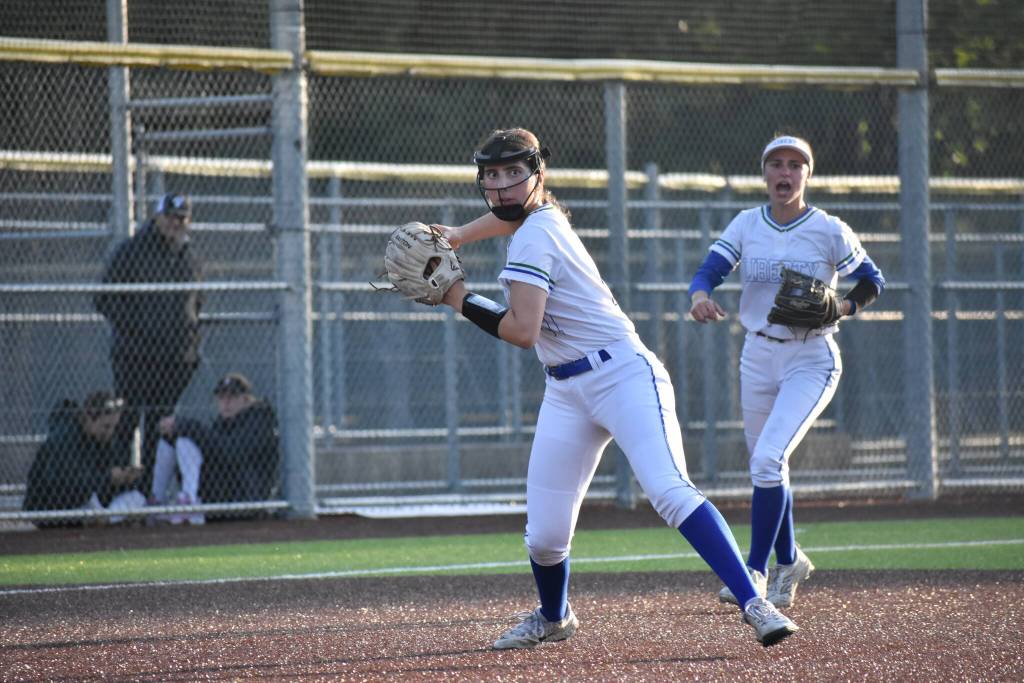 Abigail Handlin makes a throw to first base for Liberty. Ben Ray / The Reporter