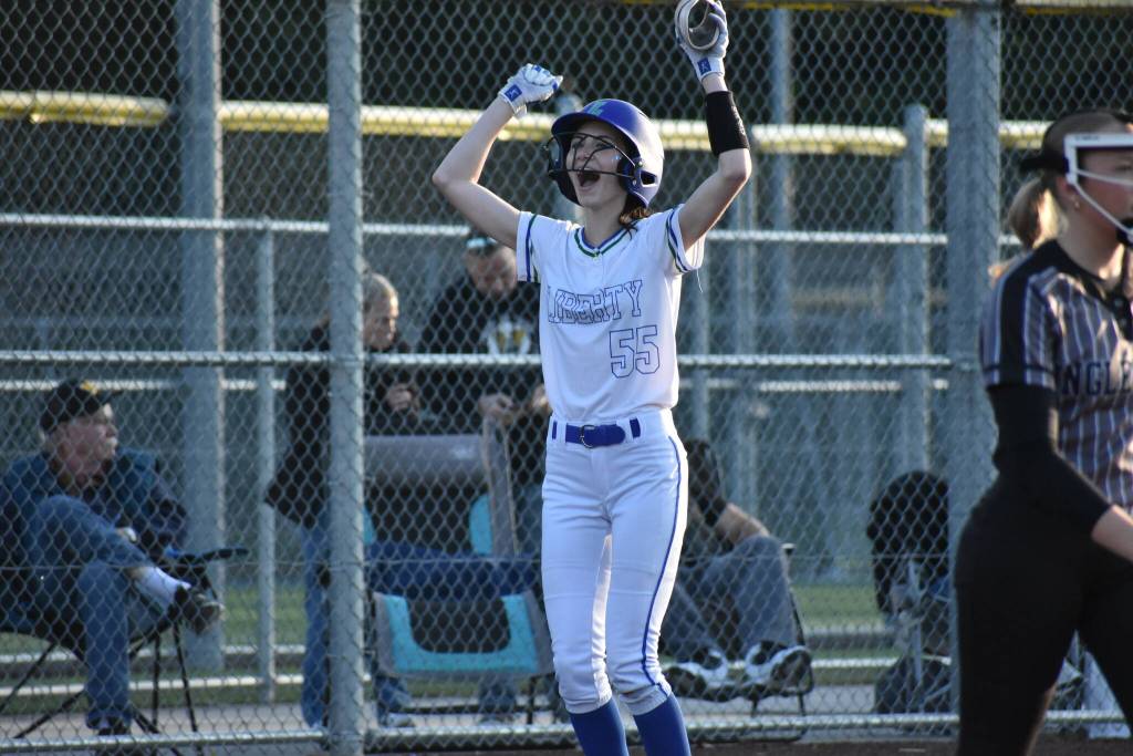 Berlyn Crockett cheers after reaching third base against Inglemoor. Ben Ray / The Reporter