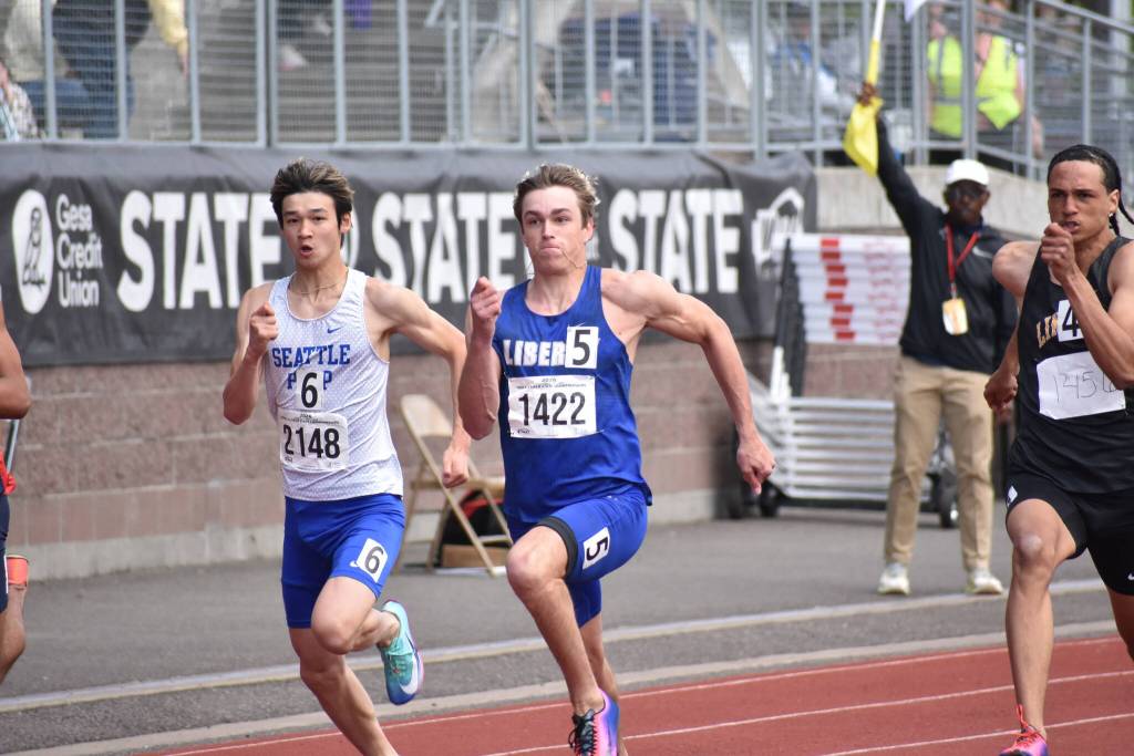 Sutton Flint wins the 100 m dash for Liberty. Ben Ray / The Reporter