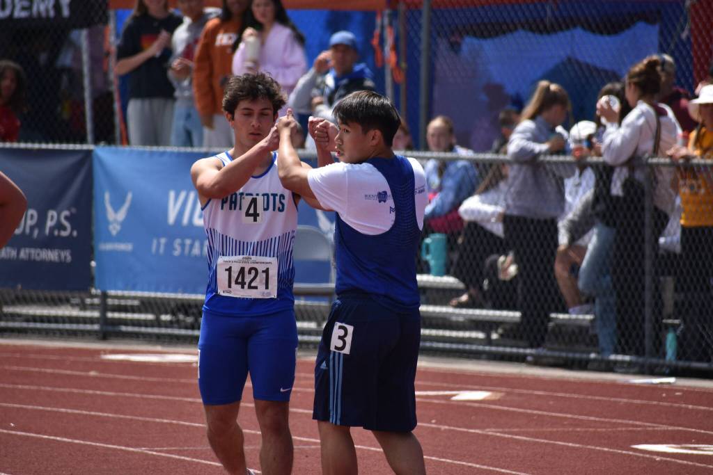Liberty unified partnership high five after their race. Ben Ray / The Reporter