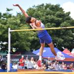 Oden Hatcher leaps over the bar at the high jump. Ben Ray / The Reporter