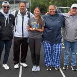 Angelica Nguyen and the Hazen track coaches stand together following her third place finish. Photo provided by Angelica Nguyen.