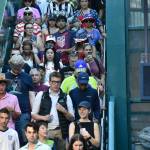 Fans pack the stairs heading to the light rail train at International District. Ben Ray / The Reporter
