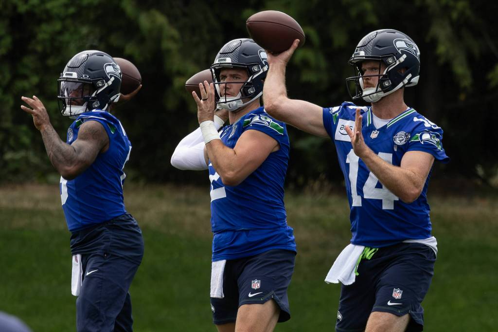 Quarterbacks Jalen Milroe, Drew Lock and Sam Darnold warm up for the Seahawks during training camp July 28 at the Virginia Mason Athletic Complex in Renton. Photo provided by Maria Dorsten