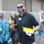WinCos Shawn hands out small aisle maps for customers as they waited to get into the new WinCo. Photo by Bailey Jo Josie/Sound Publishing.