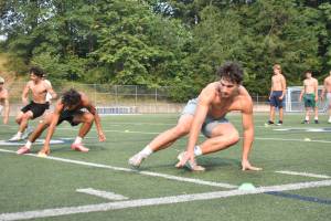 Liberty football players run a shuttle drill at practice. Ben Ray / The Reporter